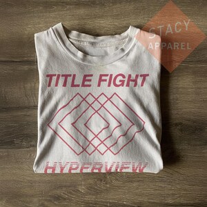Camiseta unisex de lucha por el título limitado - Camiseta de algodón grueso inspirada en Hyperview imagen 4