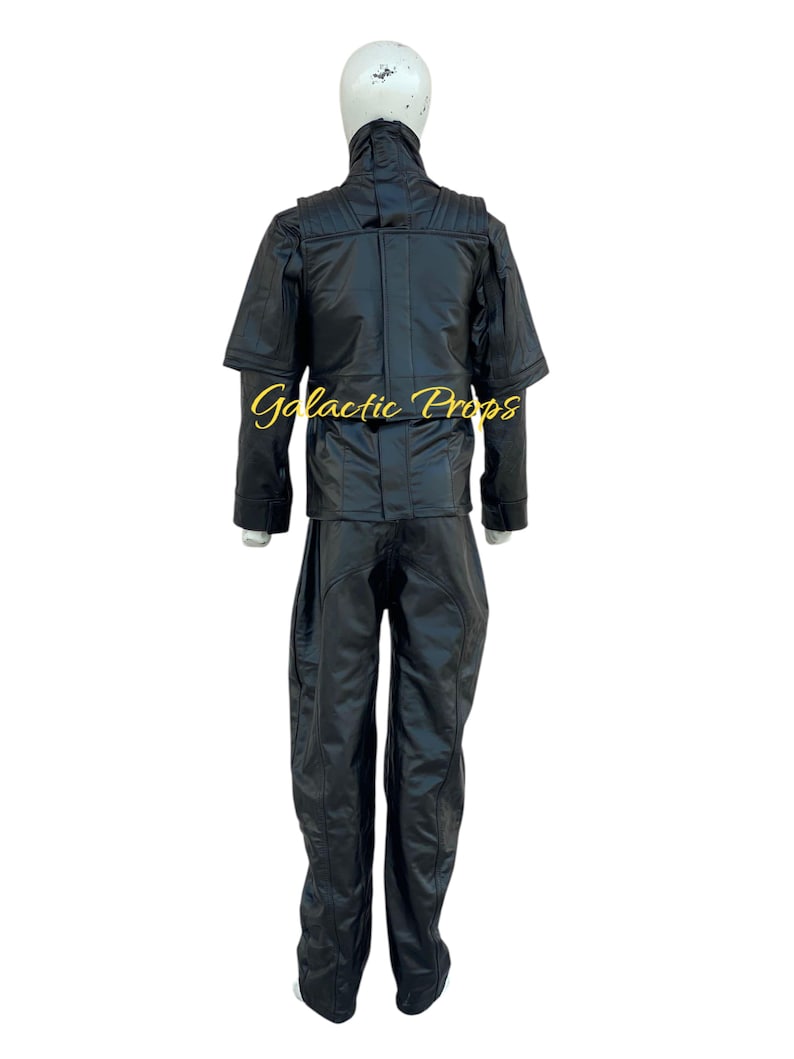 May include: Black costume with a high collar and matching pants. The outfit is displayed on a mannequin. The text "Galactic Props" is visible on the jacket. The costume appears to be made of a shiny, possibly leather-like material.