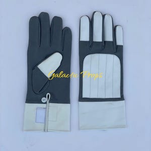 May include: A pair of gray and white gloves. The gloves have a gray main color with white accents on the fingers, cuffs, and a small patch on the back of the hand. The text "Galactic Props" is visible.