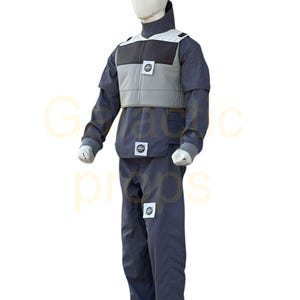 May include: A full-body costume on a mannequin. The costume is primarily dark blue with a light gray vest and white accents. Small circular patches are visible on the vest and pants. The mannequin has a white head.