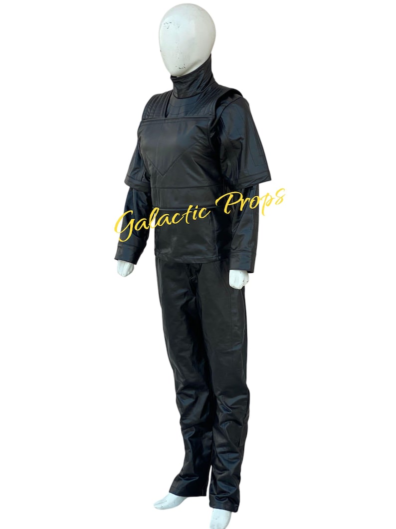 May include: A black costume displayed on a mannequin. The outfit includes a high-collared top with shoulder accents, long sleeves, and matching pants. The text "Galactic Props" is visible on the image.