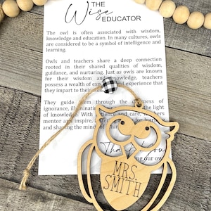 May include: Wooden owl ornament with the text "The Wise Educator" and "Thank You Mrs. Smith" on it. The owl is a symbol of wisdom, knowledge, and learning.