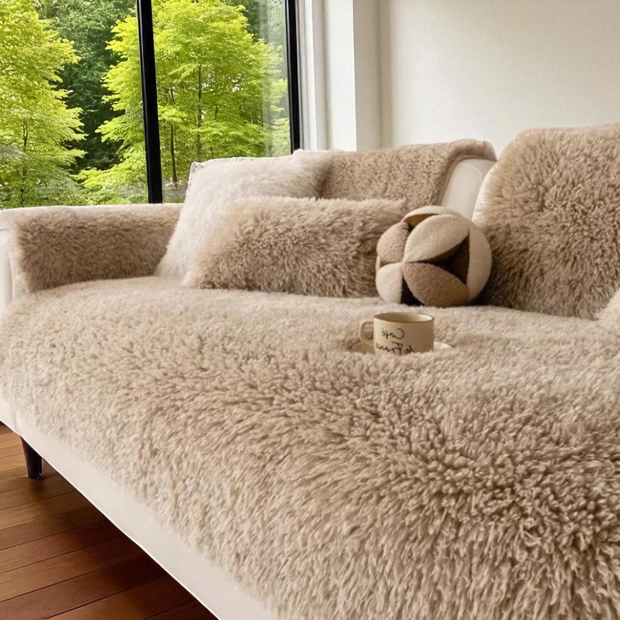 sofa with fluffy throws and pillows