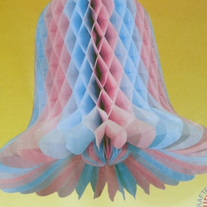 May include: A blue and pink honeycomb tissue paper bell decoration. The bell is made of multiple layers of tissue paper that are folded and then expanded to create a three-dimensional shape.