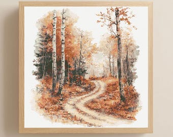 May include: A framed cross-stitch landscape depicts an autumn forest scene. The artwork features a winding dirt path leading into the distance, surrounded by trees with orange and brown foliage. The frame is made of light-colored wood.
