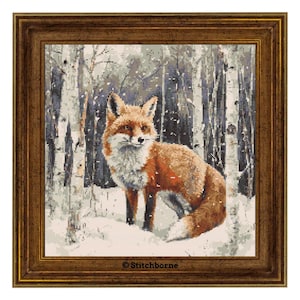 May include: Cross-stitch artwork of a red fox in a snowy forest scene, framed in a brown wooden frame. The fox has a white chest and is surrounded by birch trees. The artwork is signed "Stitchborne".