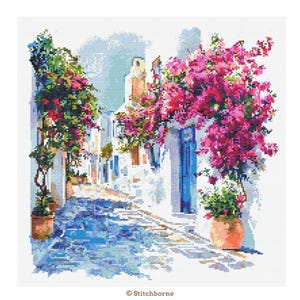 May include: Cross-stitch pattern of a sunlit alleyway with white buildings, blue doors, and a cobblestone street. Vibrant pink bougainvillea flowers cascade over the buildings and doorways. Potted plants add greenery. The scene is a colorful depiction of a Mediterranean village.