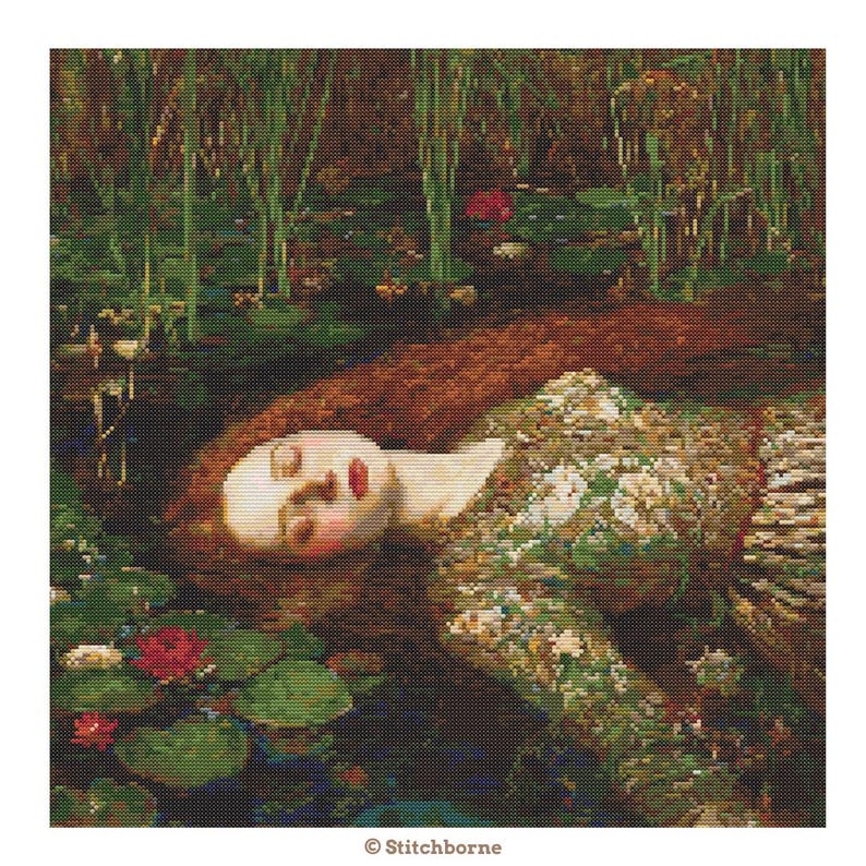 May include: A cross-stitch pattern depicting a woman with long red hair floating in water, surrounded by lily pads and reeds. She wears a green floral dress. The image has a painterly quality and is based on a famous painting.