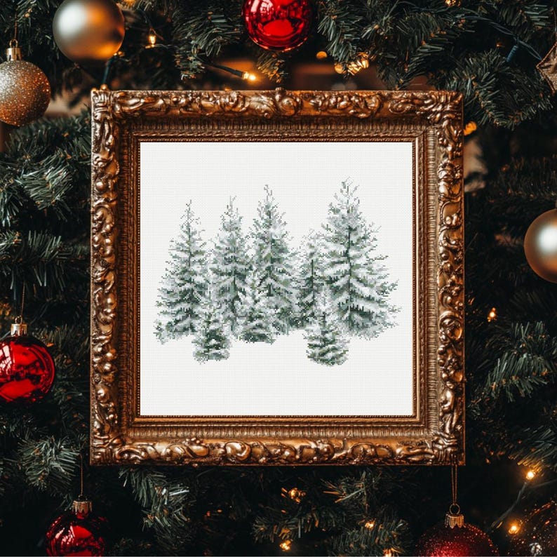 May include: A framed watercolor painting of snow-covered evergreen trees. The artwork is displayed in a gold ornate frame, set against a backdrop of a decorated Christmas tree with ornaments and lights.