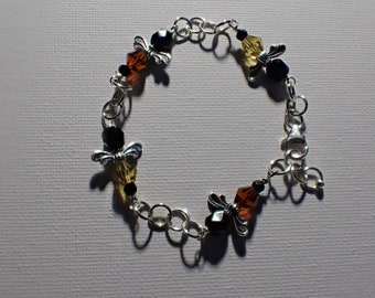 Bee bracelet. Sterling silver, and Czech glass beads combine with silver plated wings to make this very lovely bee bracelet.