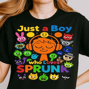 May include: Black t-shirt with the text "Just a Boy who Loves SPRUNK" in colorful letters. The design features a cartoon boy wearing headphones, surrounded by various cartoon characters in bright colors.