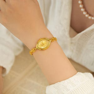 Montre bracelet dorée fleurs vintage – cadran goutte, acier inoxydable & quartz | Cadeau femme | Mon bijou à moi