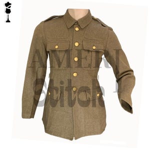 May include: A khaki-colored military jacket with gold-colored buttons and four front pockets. The jacket has a collared neckline and epaulettes on the shoulders. The text "AMERICAN Stitch" is partially visible on the jacket.