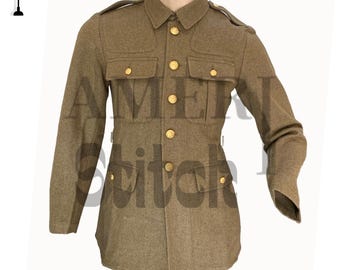 May include: A khaki-colored military jacket with gold-colored buttons and four front pockets. The jacket has a collared neckline and epaulettes on the shoulders. The text "AMERICAN Stitch" is partially visible on the jacket.