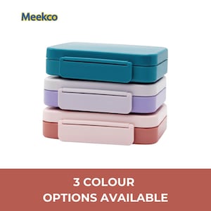 May include: A stack of three rectangular lunch boxes in teal, lavender, and pink. Each box has a matching latch. The text "Meekco" is in the upper left corner. The bottom of the image reads "3 COLOUR OPTIONS AVAILABLE."