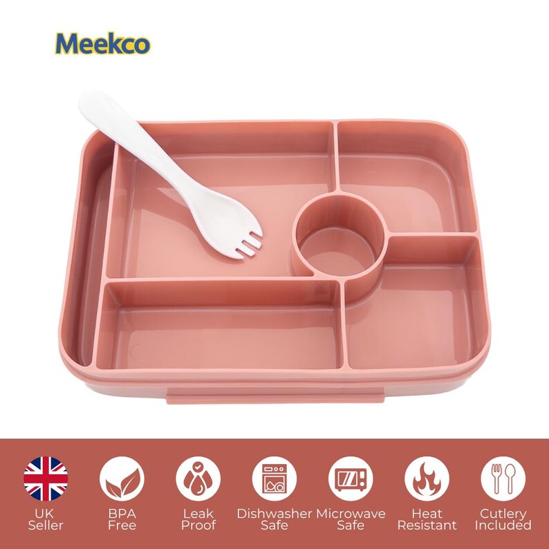 May include: A pink divided lunch tray with a white fork-spoon utensil. The tray has multiple compartments and a circular cup holder. The image also shows icons indicating the product is BPA-free, leak-proof, dishwasher and microwave safe, heat resistant, and includes cutlery.