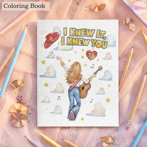 May include: A colouring book cover featuring a person with long hair seen from behind, wearing blue jeans and holding an acoustic guitar. The illustration includes a red cowboy hat, a red heart with the text TS, clouds, stars, and the text I KNEW IT, I KNEW YOU.