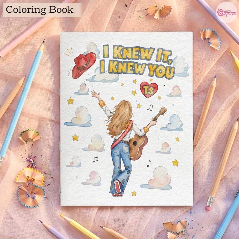 May include: A colouring book cover featuring a person with long hair seen from behind, wearing blue jeans and holding an acoustic guitar. The illustration includes a red cowboy hat, a red heart with the text TS, clouds, stars, and the text I KNEW IT, I KNEW YOU.