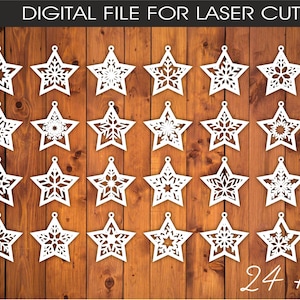 May include: A set of 25 white star-shaped laser cut ornaments with snowflake patterns, arranged on a wooden surface. The image includes the text "DIGITAL FILE FOR LASER CUT". The bottom right corner shows "24 + 1 pcs".