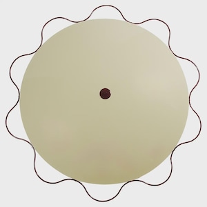 May include: Overhead view of a cream-colored, round ceiling light fixture. The light has a scalloped, dark red metal trim around the edge. A small, dark red dot is in the center of the light.