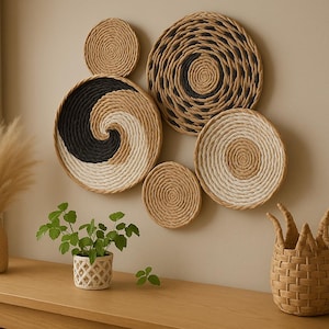 May include: A wall decor set of six woven round wall hangings in various sizes and patterns. The wall hangings are made of natural materials and have a neutral colour palette of beige, brown, and black.