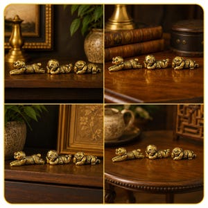 May include: A set of three small, gold-toned metal monkey figurines in different poses. One monkey lies flat with its mouth open, the second rests its head on its hand, and the third covers its eyes with its hands. Each figure has a textured finish.