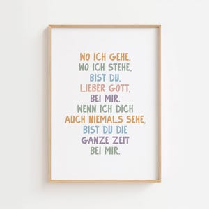 May include: A framed print with the text "WO ICH GEHE, WO ICH STEHE, BIST DU, LIEBER GOTT, BEI MIR. WENN ICH DICH AUCH NIEMALS SEHE, BIST DU DIE GANZE ZEIT BEI MIR." in various pastel colors. The frame is a light brown.