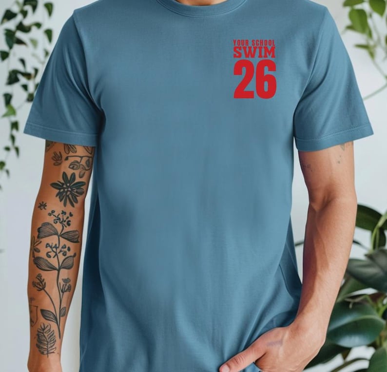 Example of Design on front of tee, Red Text on Slate Blue. Add custom school or mascot name on top line.