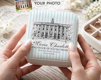 May include: A personalized jewelry box with a light blue and white striped pattern. The box features a black and white illustration of a building and the text "Maria Charlott, Bachelor of Social Work, New York State University, Class of 2026."