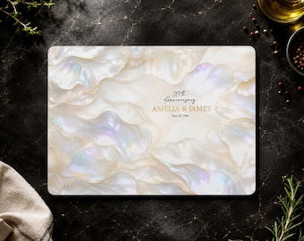 May include: A rectangular cutting board featuring a white, iridescent, and pearlescent wavy pattern with gold-toned edges. The center displays the text 30th Anniversary, AMELIA & JAMES, and May 09, 1996 in a black and gold serif and script font.