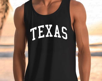 May include: Black tank top with the word "TEXAS" printed in white, bold, block letters across the chest. The sleeveless shirt has a rounded neckline and is made of a soft, comfortable material.