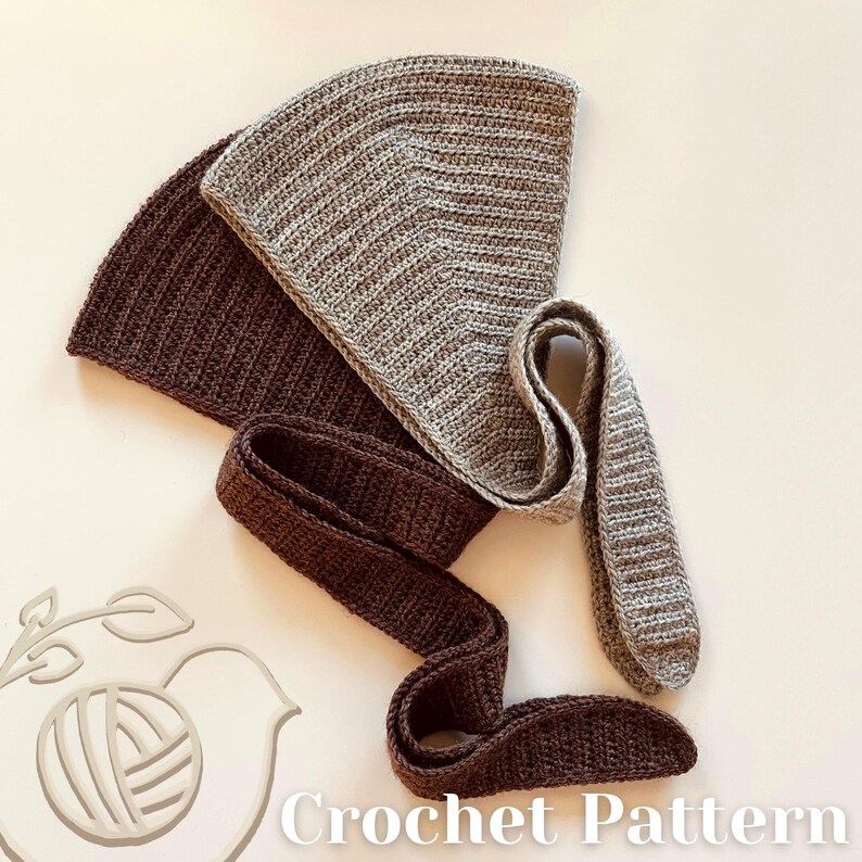 May include: A crochet pattern showing two triangular pieces and two long, narrow strips of crocheted fabric in shades of brown and grey. The text "Crochet Pattern" is at the bottom. The items are arranged on a light-coloured surface.