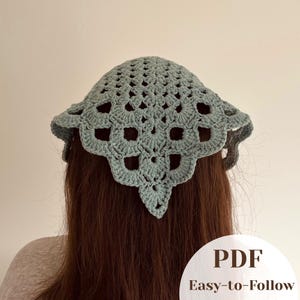 May include: A sage green crochet headscarf featuring a repeating openwork pattern with a scalloped edge. The item is presented with a circular white graphic overlay in the bottom right corner containing the text PDF Easy-to-Follow.