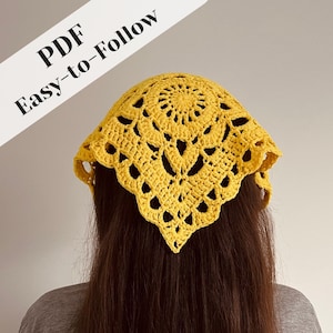 May include: A yellow crochet headscarf with a circular floral design and a scalloped edge. The headscarf is made of a soft, textured yarn. Text on the image reads "PDF Easy-to-Follow".