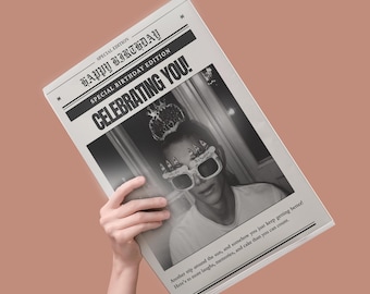 May include: A black and white newspaper-style print with the headline "HAPPY BIRTHDAY" and "CELEBRATING YOU!". The image features a person wearing birthday glasses and a crown. The text reads, "Another trip around the sun..."
