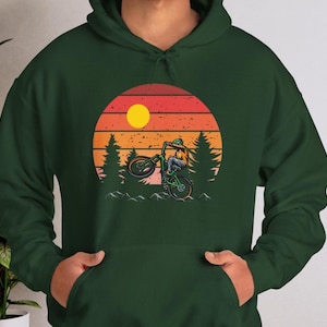 Mountain Adventure, T-shirt with Cyclist Print Against Sunset , Hoodies and Sweatshirts for Nature Lovers, Bike for Mountain, Sun and Forest