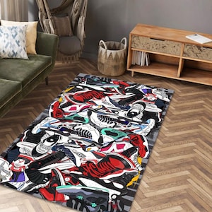 May include: A rectangular area rug featuring a vibrant collage of sneakers in various colors, including red, black, white, and blue. The rug's design showcases a dynamic arrangement of athletic footwear, creating a bold statement piece for any room.