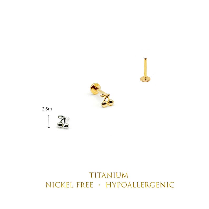 May include: A silver-colored cherry-shaped stud earring and a gold-colored cherry-shaped stud earring with a flat back post. The silver earring is labeled with a 3.6mm measurement. Text reads: TITANIUM, NICKEL-FREE, HYPOALLERGENIC.
