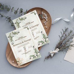 May include: Two wedding invitations with a floral design. The invitations are printed on white cardstock with a gold border. The text on the invitations reads "Rebecca & George" and "Together with family and friends".