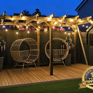 May include: A wooden pergola structure featuring a string of warm glowing lights, two circular rattan-style chairs, and a wooden deck floor. A gold badge in the corner displays the text 15 YEAR GUARANTEE, indicating a long-term product warranty.