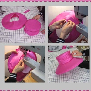 May include: A close-up of a pink hat being sewn on a sewing machine. The hat is being sewn around the brim, and the sewing machine is visible in the background.