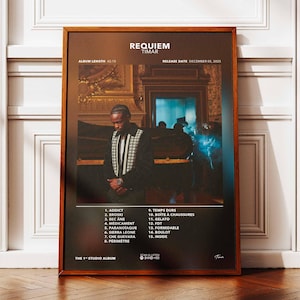 May include: A framed poster for the album "Requiem" by Timar. The poster features a photograph of a man in a black and white patterned jacket. The album title and artist name are at the top, with a tracklist below. The album length is 42:15.