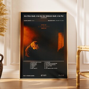 May include: A framed poster with a black background features the text "DU PEU QUE J'AI EU DU MIEUX QUE J'AI PU" and "LESRAM." The poster includes a blurred image of a person and a list of song titles. The album length is 33:26, and the release date is January 19, 2024.