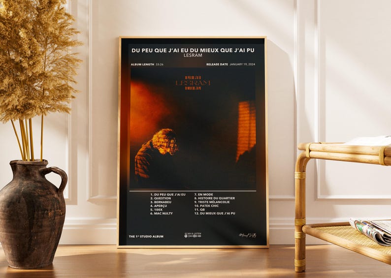 May include: A framed poster with a black background features the text "DU PEU QUE J'AI EU DU MIEUX QUE J'AI PU" and "LESRAM." The poster includes a blurred image of a person and a list of song titles. The album length is 33:26, and the release date is January 19, 2024.