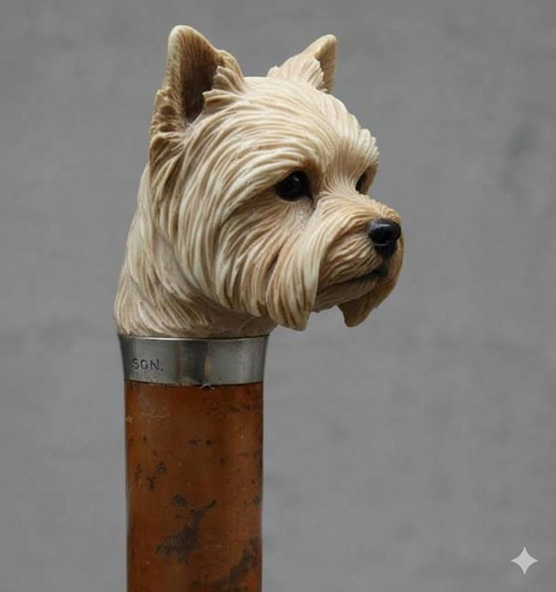 May include: A walking cane with a carved dog head handle. The dog head is a light beige color with detailed fur and dark eyes. The handle is brown with a silver band that reads "SGN."