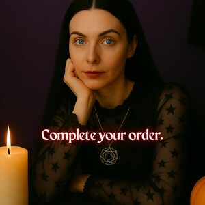 May include: A woman with long black hair sits at a table with a lit candle, tarot cards, and a pumpkin. She is wearing a black shirt with stars and a geometric pendant necklace. The text "Complete your order." is displayed in red.