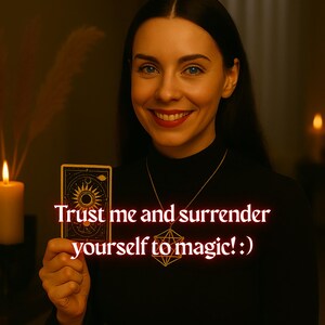 May include: A woman with long dark hair smiles while holding a tarot card with a sun and moon design. The text "Trust me and surrender yourself to magic!" is superimposed on the image.
