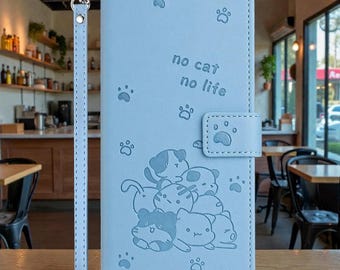 Funda tipo cartera para iPhone con correa y diseño de gato en relieve