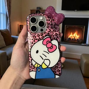 Hello Kitty iPhone Hülle: Glitzernde Hartcover-Hülle mit 3D Schleifen-Anhänger C