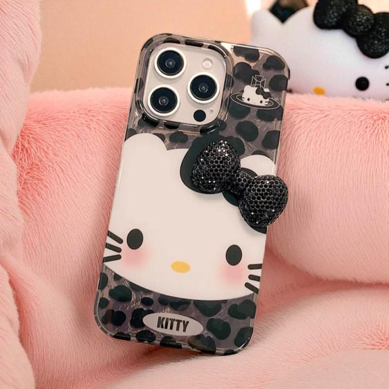Hello Kitty iPhone Hülle: Glitzernde Hartcover-Hülle mit 3D Schleifen-Anhänger E